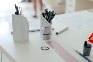 Organized pencils sit on a white desk.