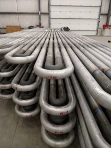 Stacks of newly manufactured boiler tubes ready for installation at Helfrich Brothers Boiler Works.